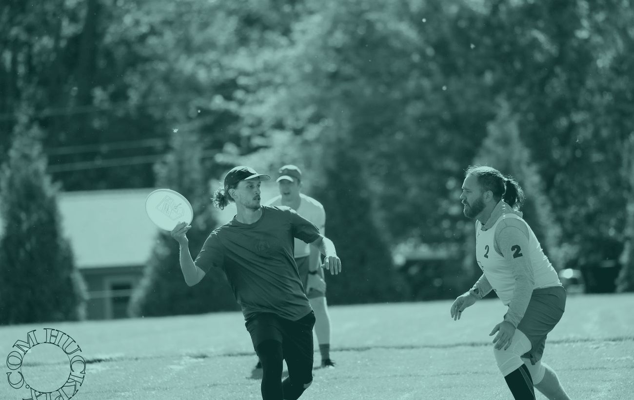 Russ Allen throwing a disc during an ultimate frisbee game.
