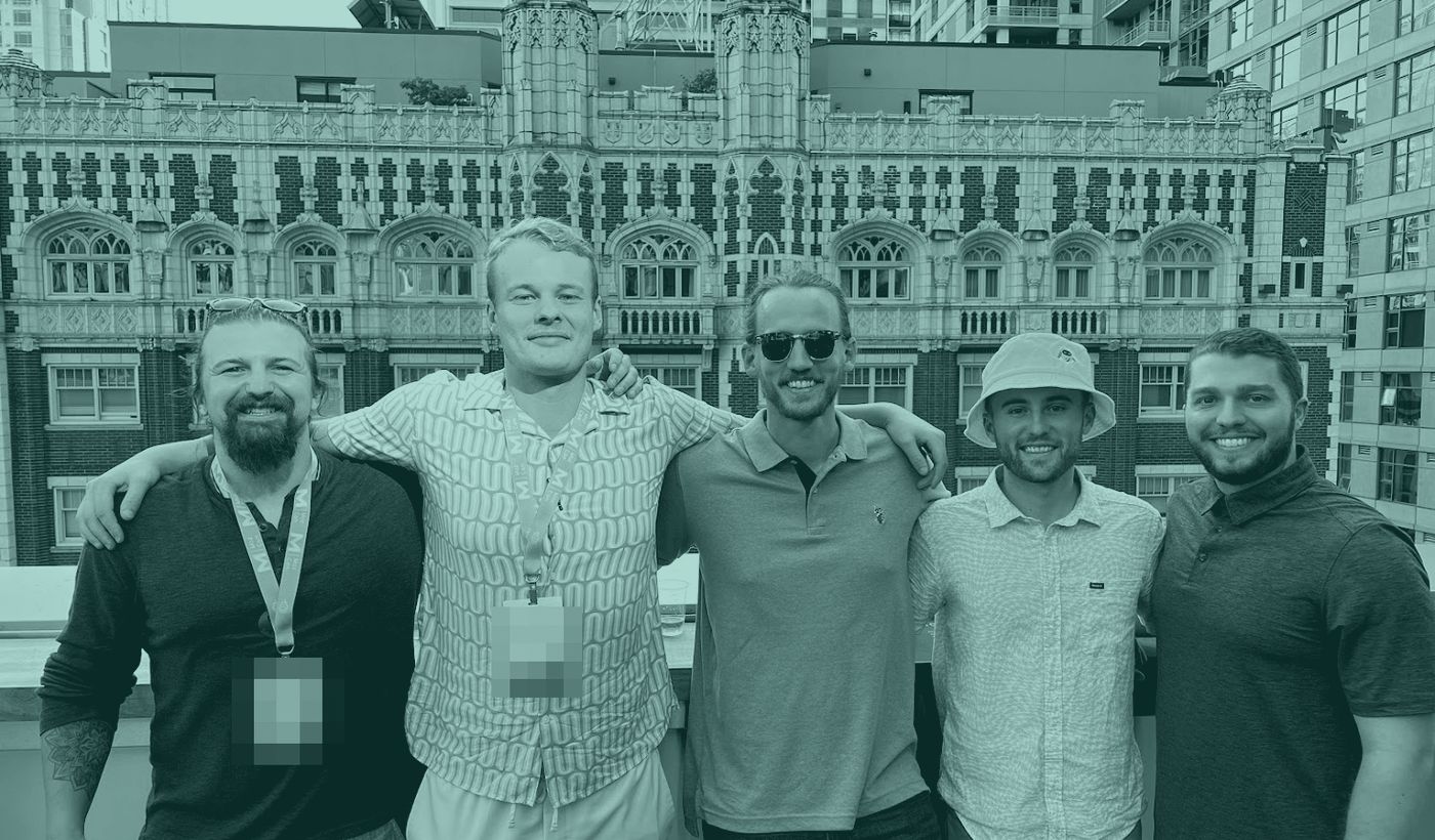 Russ Allen with four other marketing professionals on a rooftop at an industry conference.