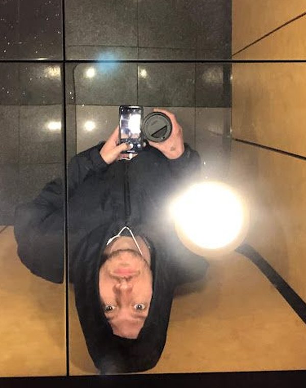 Russ Allen, mirror selfie with a phone and a coffee